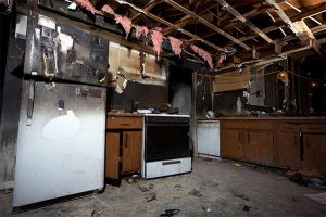 A fire damaged kitchen in a home before fire damage restoration in Orange County, CA