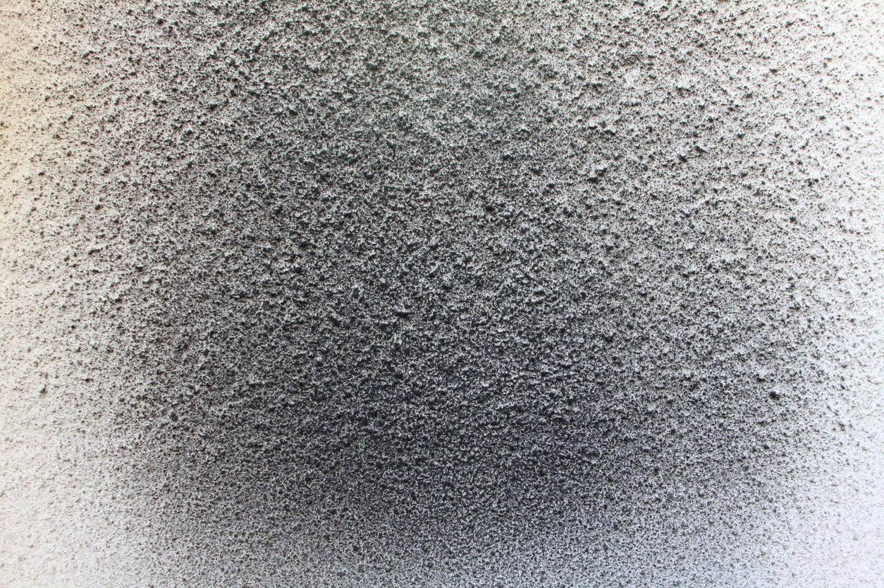black soot on white wall